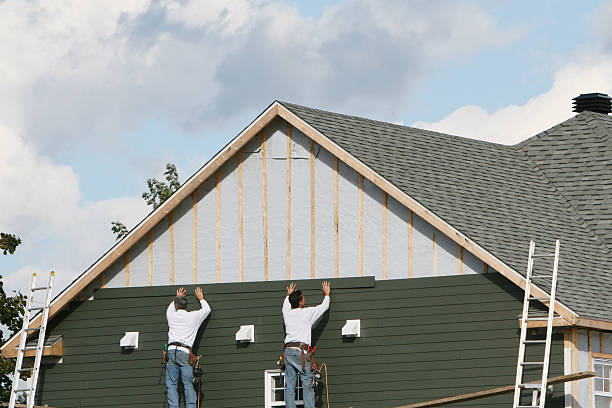Professional Siding technician working in East Canton, OH
